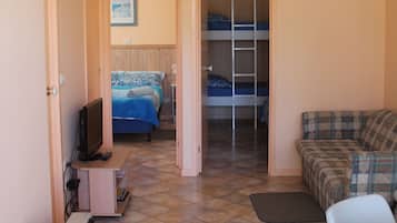 Two Bedroom Waterfront Cabin | Living area | Flat-screen TV