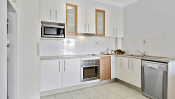 Deluxe Apartment, 1 Bedroom, Partial Ocean View | Private kitchen | Fridge, microwave, coffee/tea maker, electric kettle