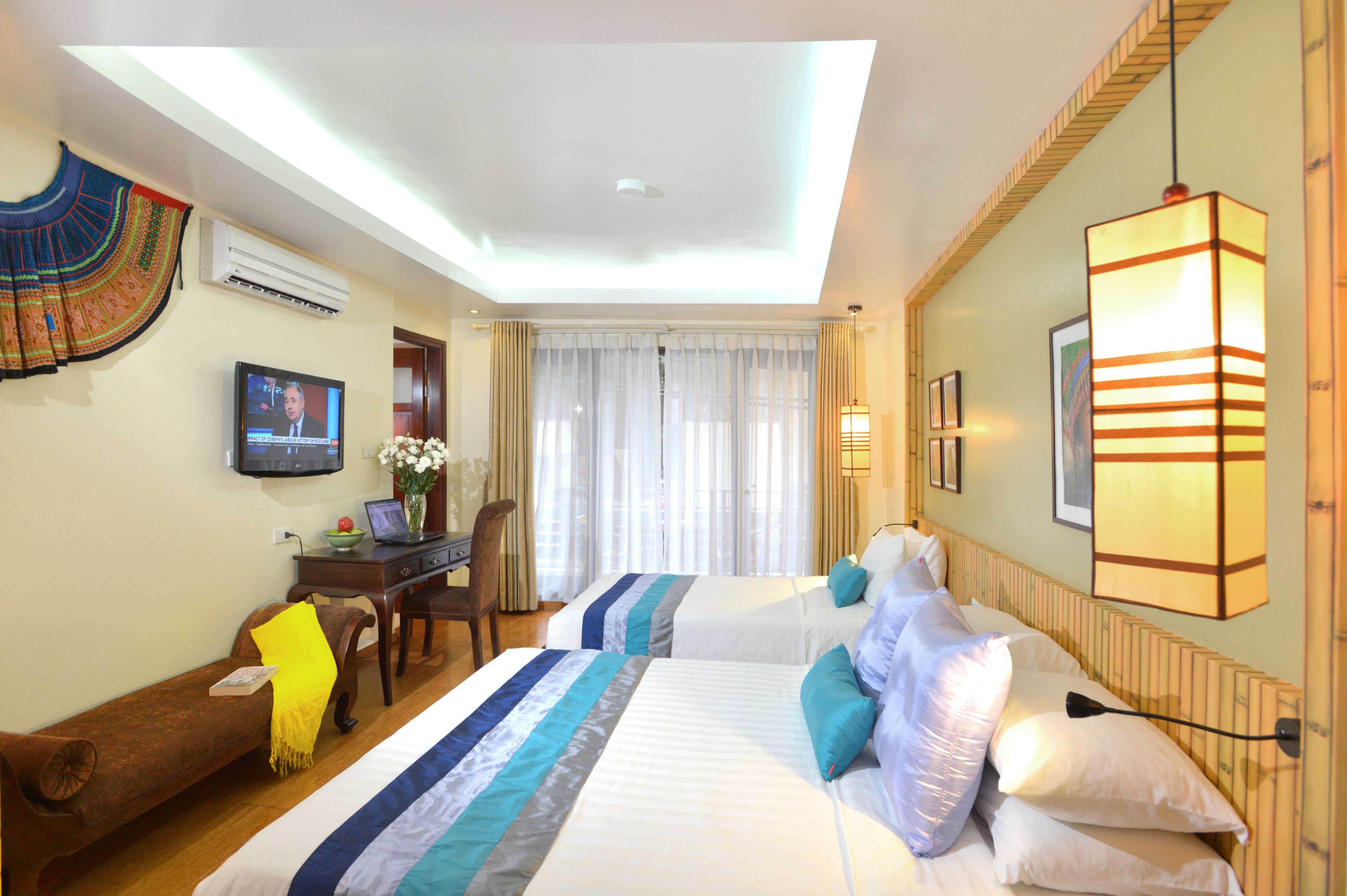 deluxe balcony triple room | minibar, in-room safe, individually decorated, blackout curtains