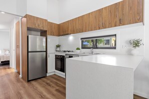 Villa (3BR) | Private kitchen | Fridge, microwave, stovetop, electric kettle