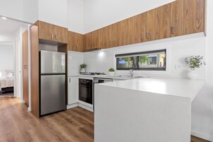 Villa (3BR) | Private kitchen | Fridge, microwave, stovetop, electric kettle