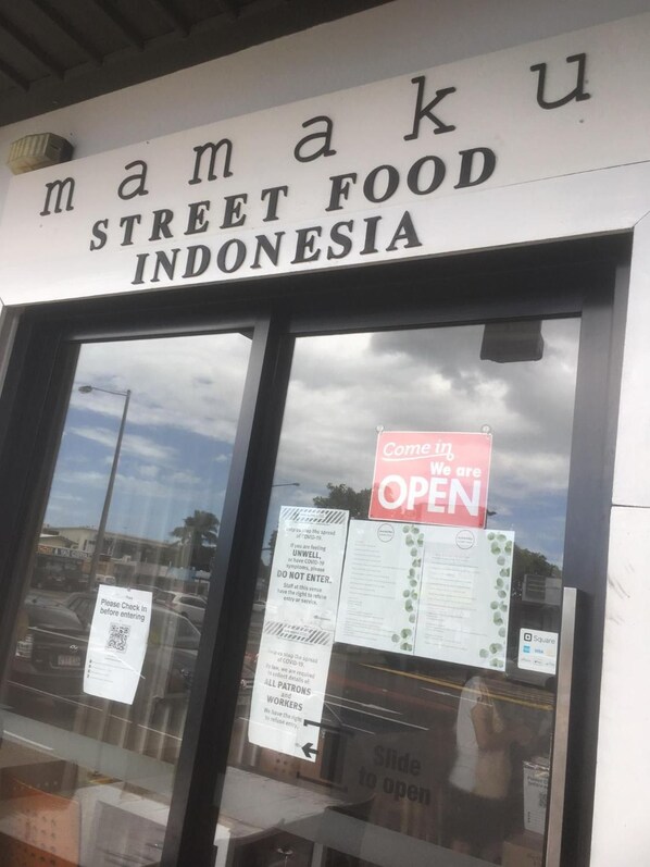 A street food restaurant named 'Mamaku Street Food Indonesia' with a sign indicating it is open. - Airport Clayfield Motel (Clayfield)