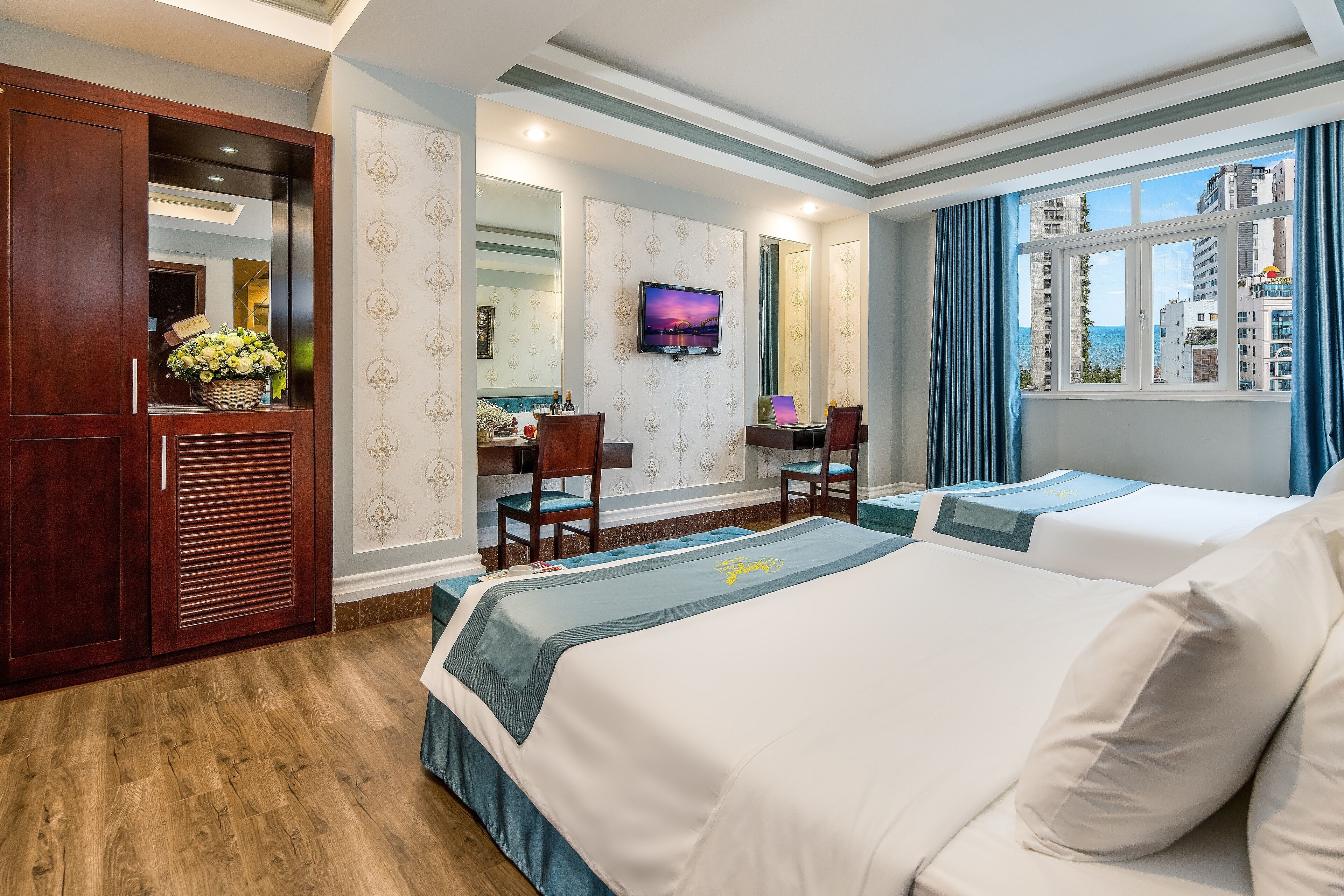 family room, sea view | minibar, in-room safe, desk, laptop workspace