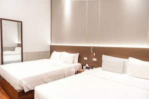 Family Quadruple Room | Minibar, in-room safe, blackout curtains, iron/ironing board