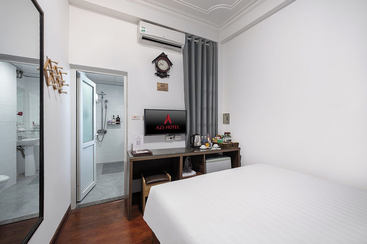Standard Double Room | Minibar, in-room safe, blackout drapes, iron/ironing board