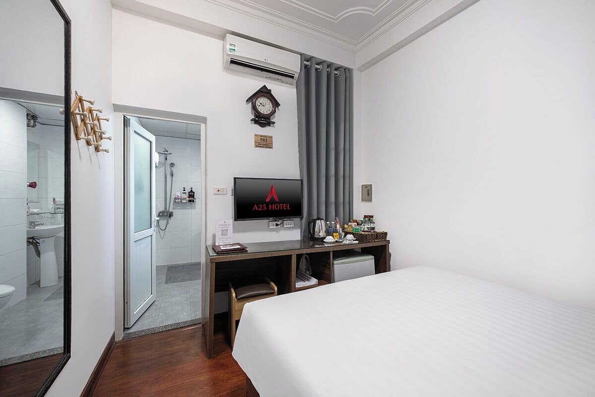 Standard Double Room | Minibar, in-room safe, blackout drapes, iron/ironing board