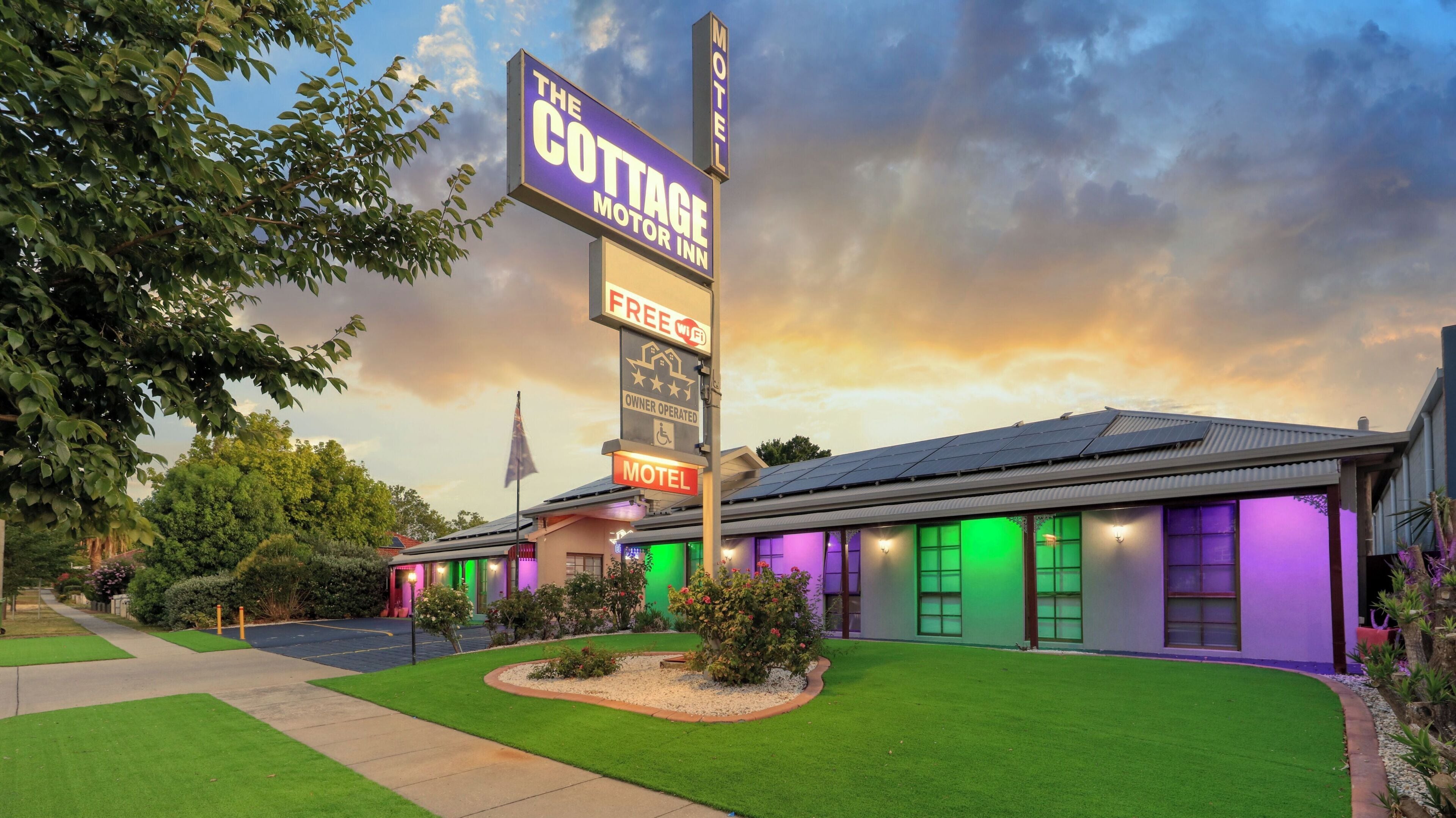 A motel with a sign indicating free WiFi and owner operation.