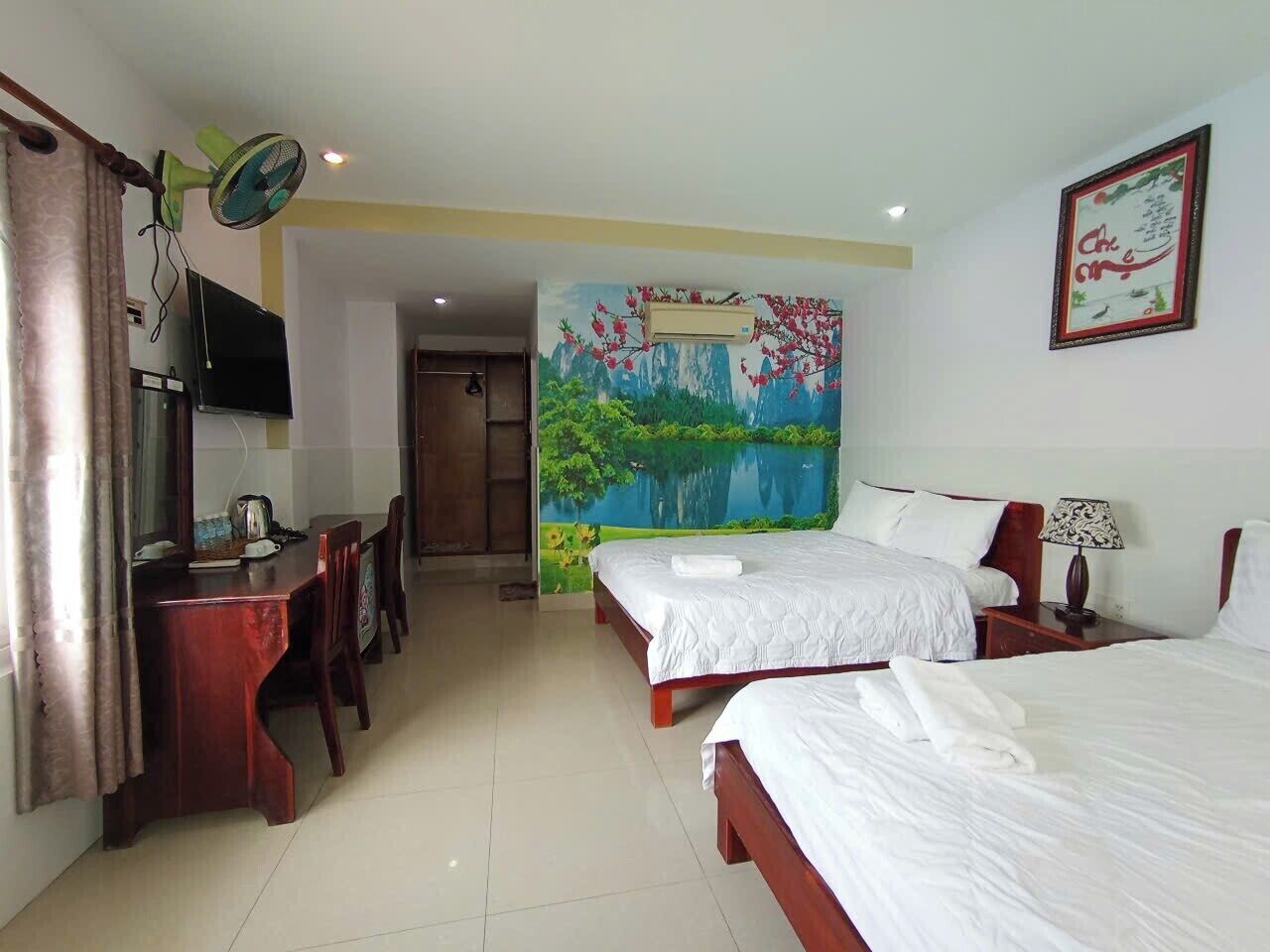 Deluxe Triple Room, 2 Double Beds, Garden View
