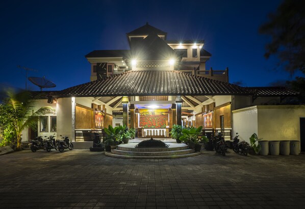 A building with a tiled roof and a central courtyard.