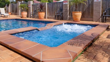 Outdoor pool, open 8:00 AM to 6:00 PM, pool umbrellas, pool loungers