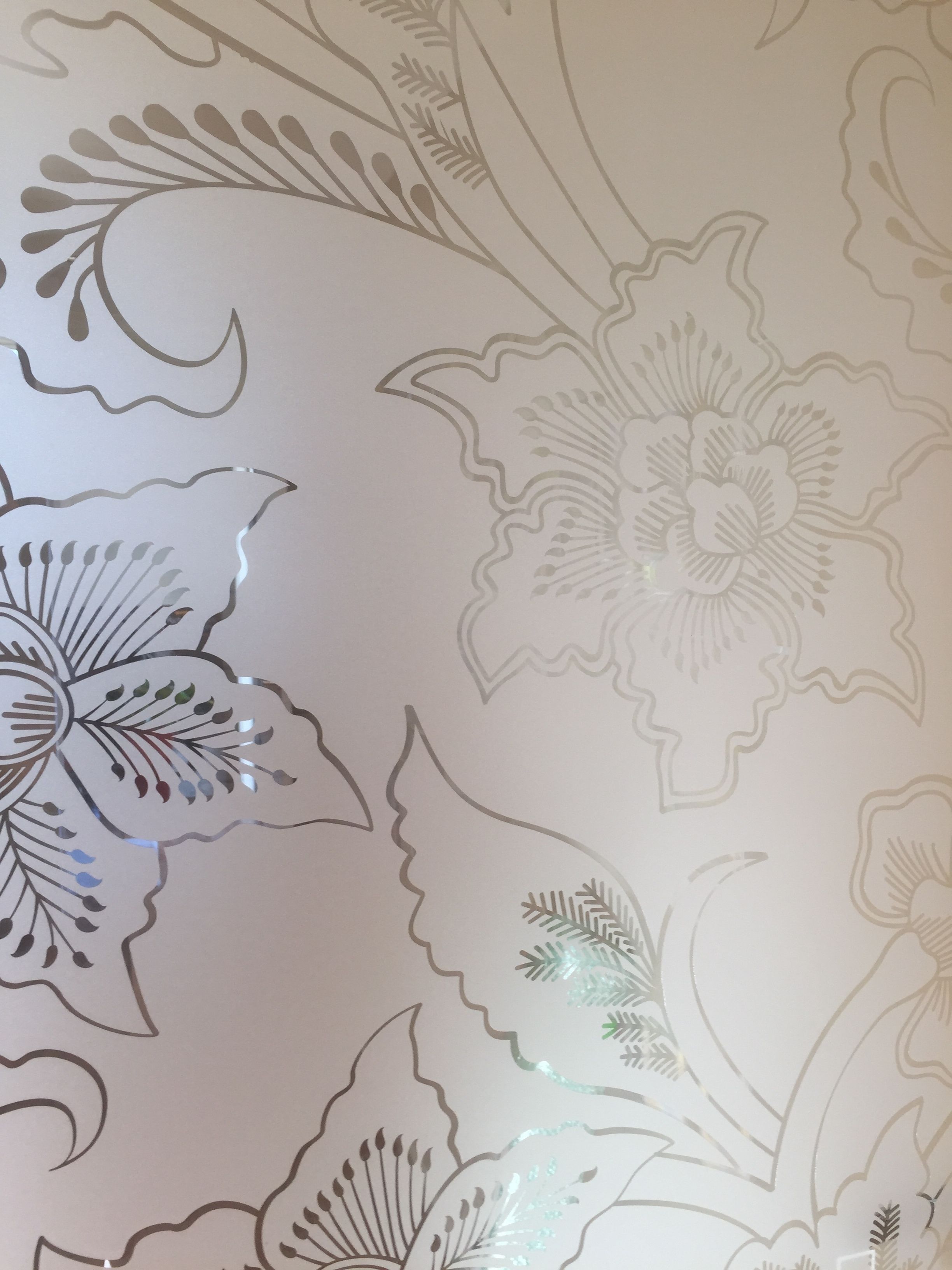 A wall with a floral pattern.
