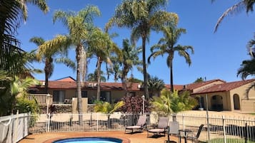 Seasonal outdoor pool, pool loungers