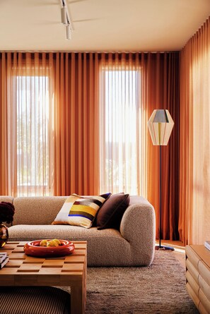 Deluxe Apartment | Living area | 55-inch Smart TV with digital channels, streaming services - Dolphins Motel (Mollymook)