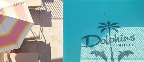 Outdoor pool, open 6:00 AM to 10:00 PM, pool umbrellas, pool loungers