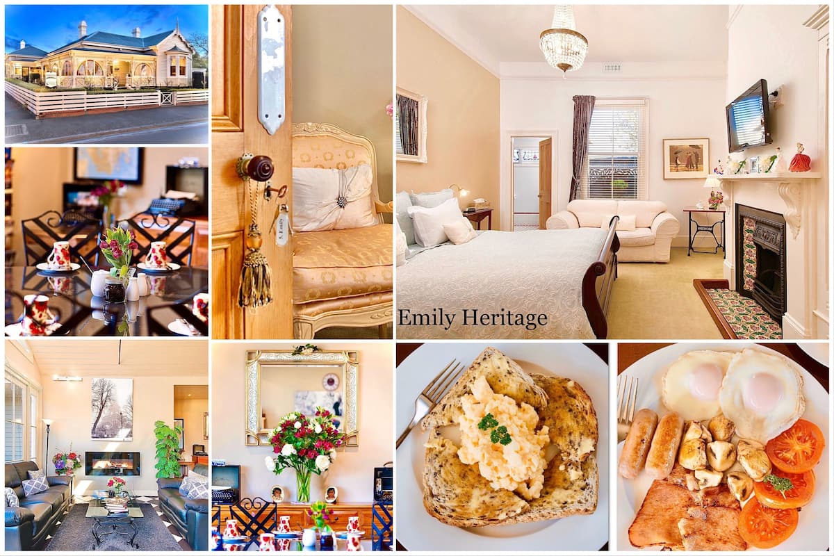 A hotel interior with a dining area, a bedroom, a living room, and a breakfast setting.