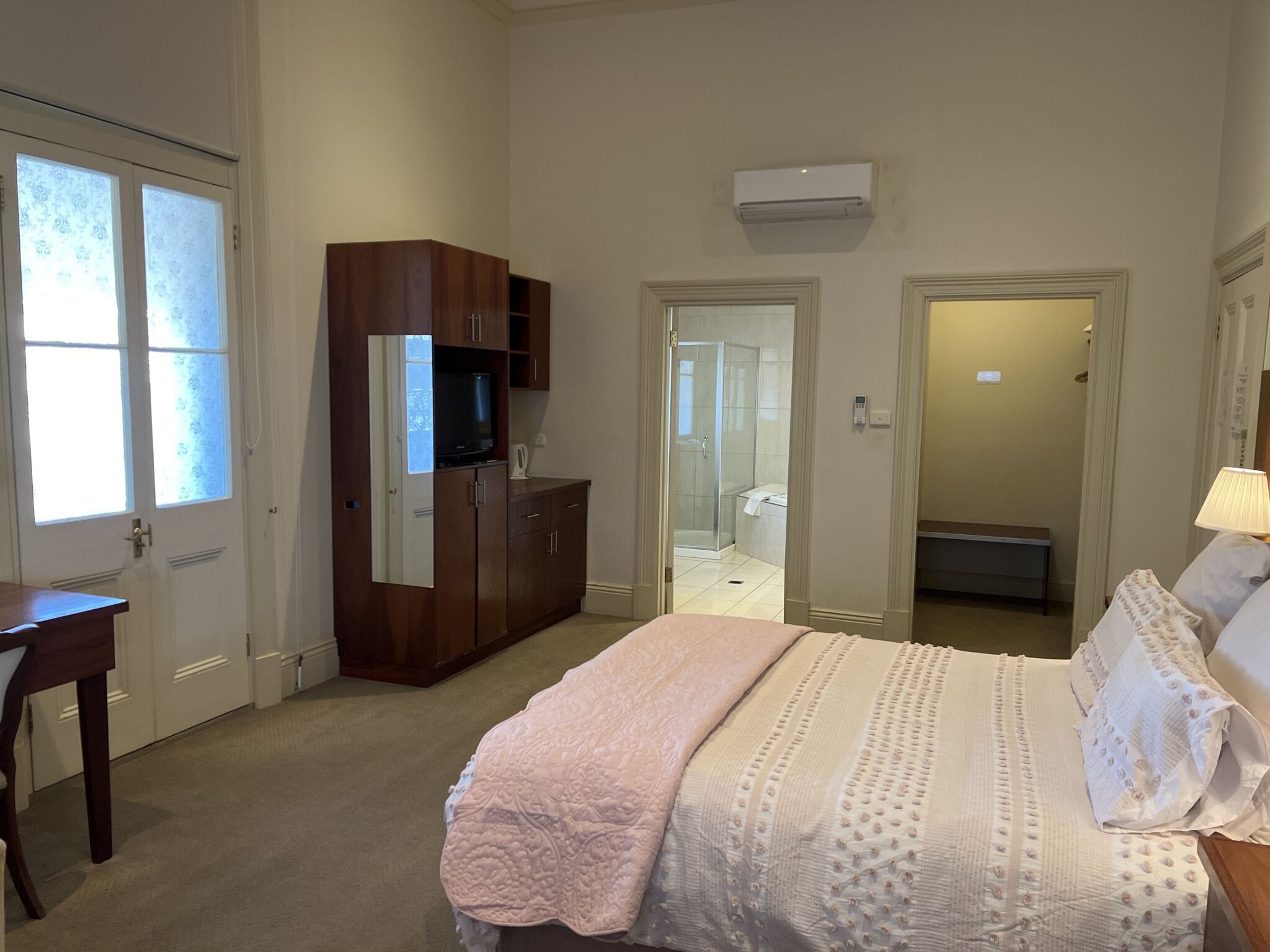 deluxe suite | premium bedding, minibar, desk, laptop workspace