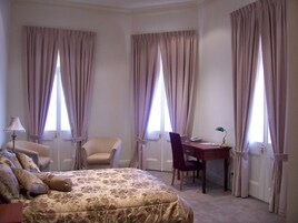 Deluxe Suite | Premium bedding, minibar, desk, laptop workspace