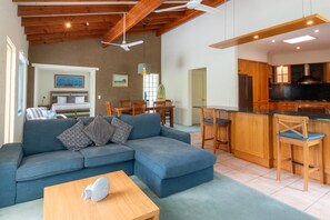 Executive Apartment, 1 King Bed | Living area | LCD TV, DVD player - Blueys Motel (Blueys Beach)