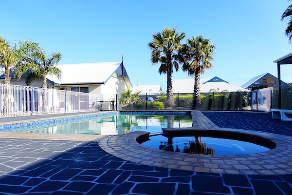 Outdoor pool, pool umbrellas, sun loungers