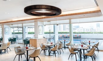 Breakfast, lunch, dinner served; international cuisine, pool views 