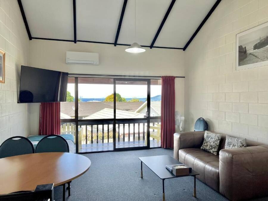 Lake View Two-bedroom Apartment | Living area | Flat-screen TV