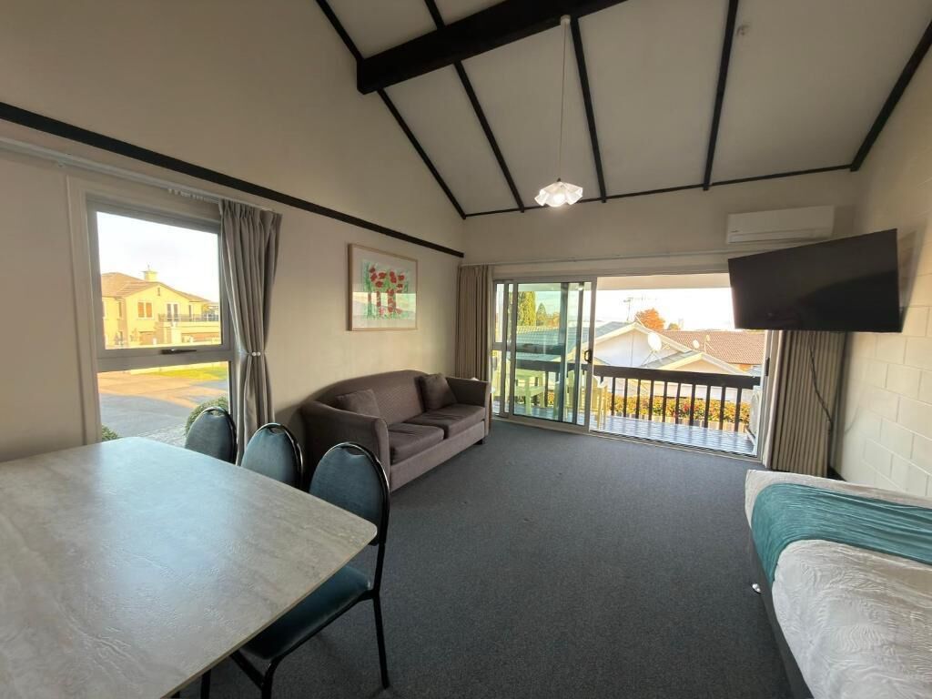 Apartment with Lake view | Living area | Flat-screen TV