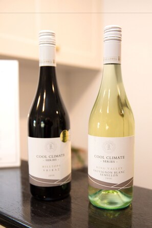 Two wine bottles labeled "Cool Climate Series" on a dark surface. - Centralpoint Motel (Wagga Wagga)
