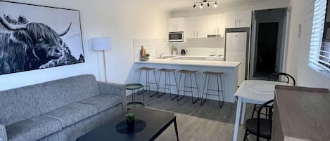 Three Bedroom Apartment | Living area | Flat-screen TV