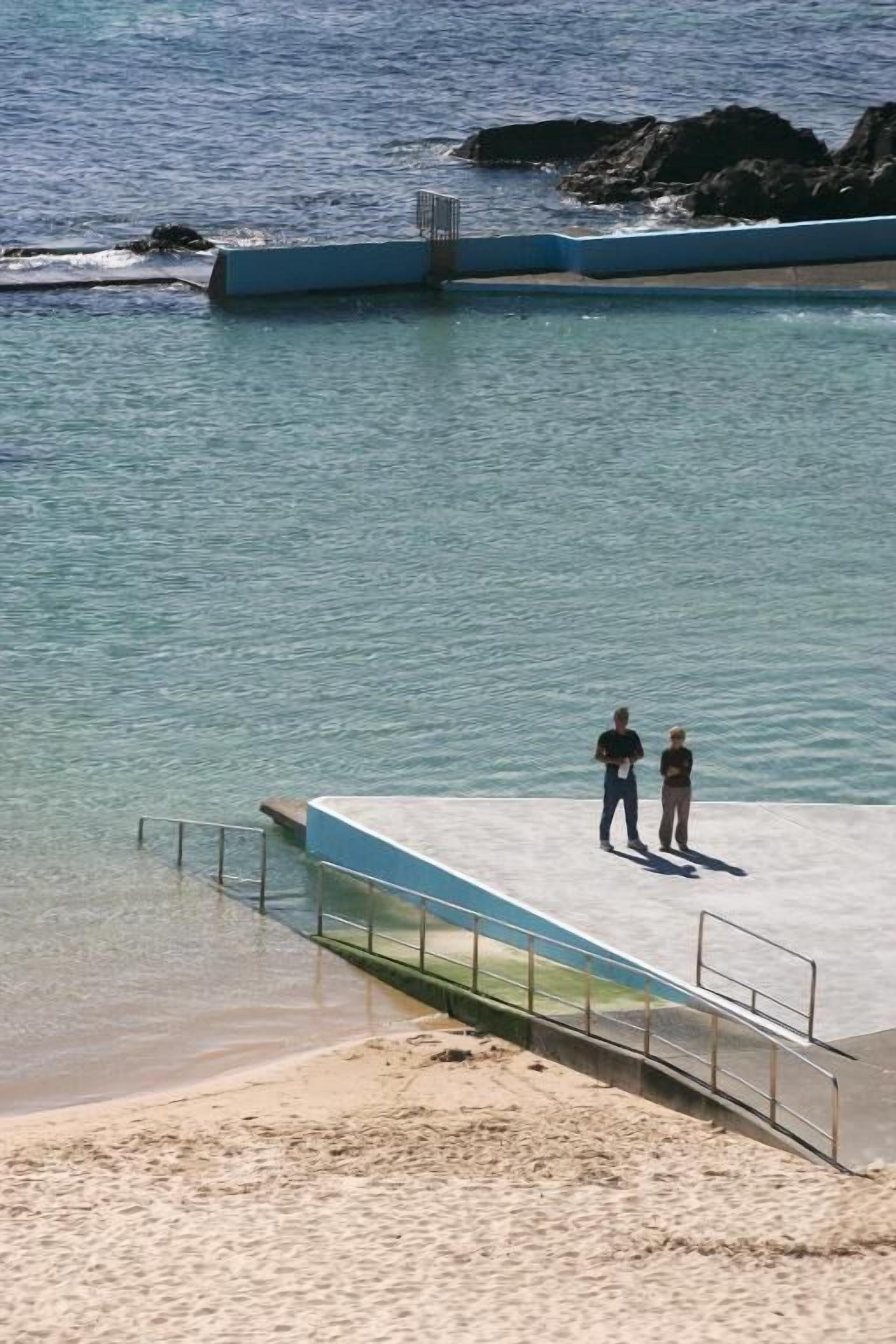 beach nearby, white sand, beach towels