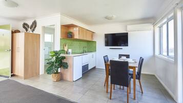 Deluxe Studio, Kitchen, Ocean View | Private kitchen | Fridge, microwave, stovetop, dishwasher