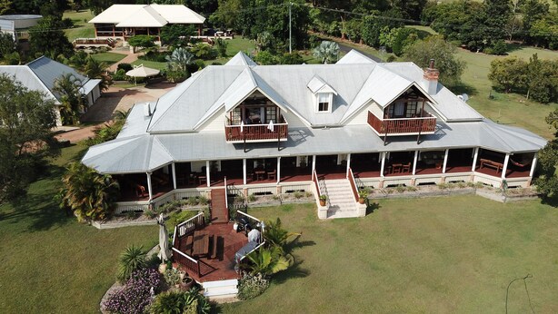 A large, two-story building with a covered patio area and multiple balconies. - Clarence River Bed & Breakfast (Seelands)