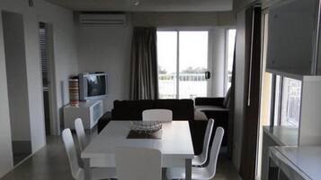 Three Bedrooms Rooftop Apartment | Living area | 40-inch flat-screen TV with cable channels, TV, DVD player