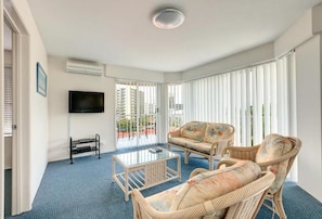 Two Bedrooms Apartment | Living area | 40-inch flat-screen TV with cable channels, TV, DVD player