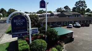 A hotel sign with a crown logo, indicating a brand name.