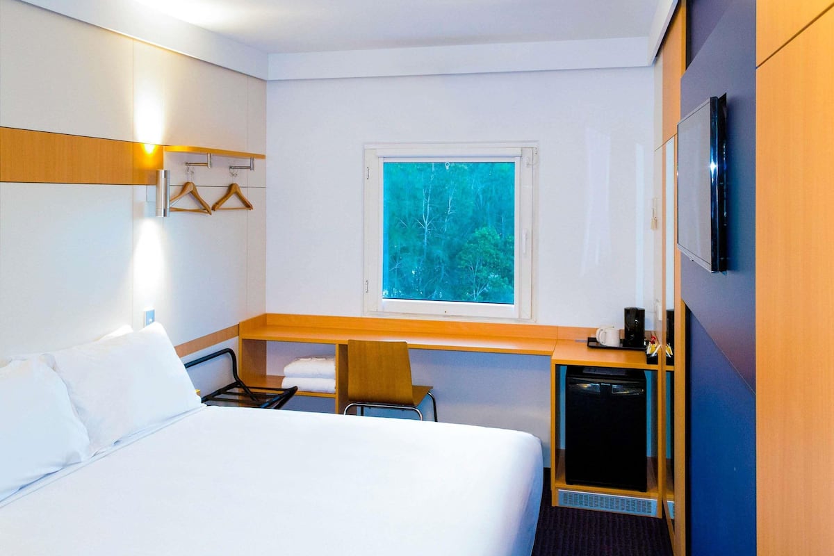 Desk, laptop workspace, blackout curtains, free WiFi