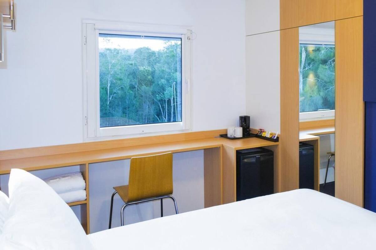 Desk, laptop workspace, blackout curtains, free WiFi