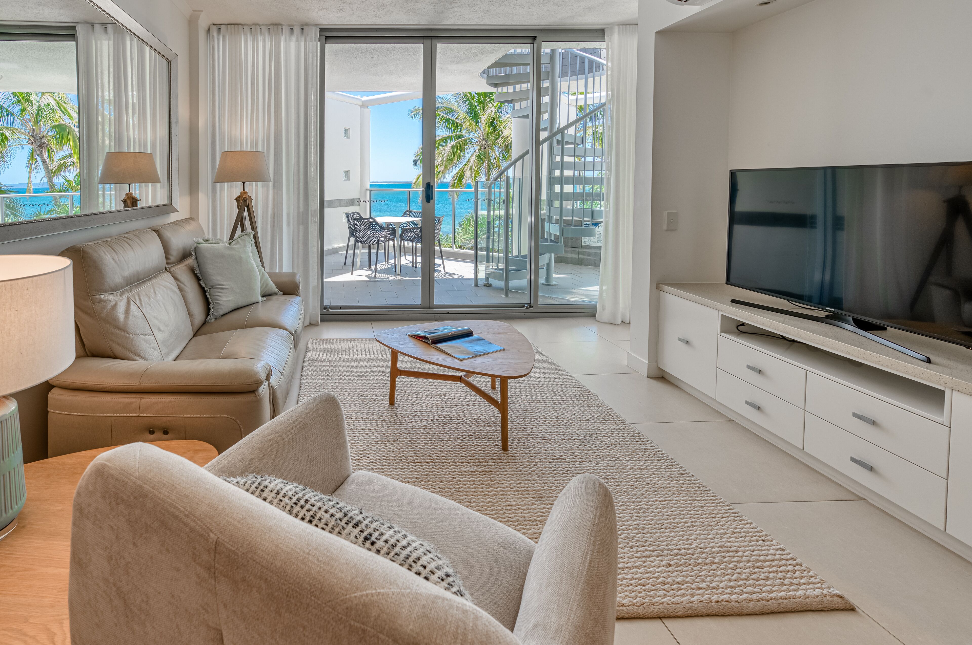 one bedroom beachfront spa penthouse | living area | flat-screen tv, dvd player