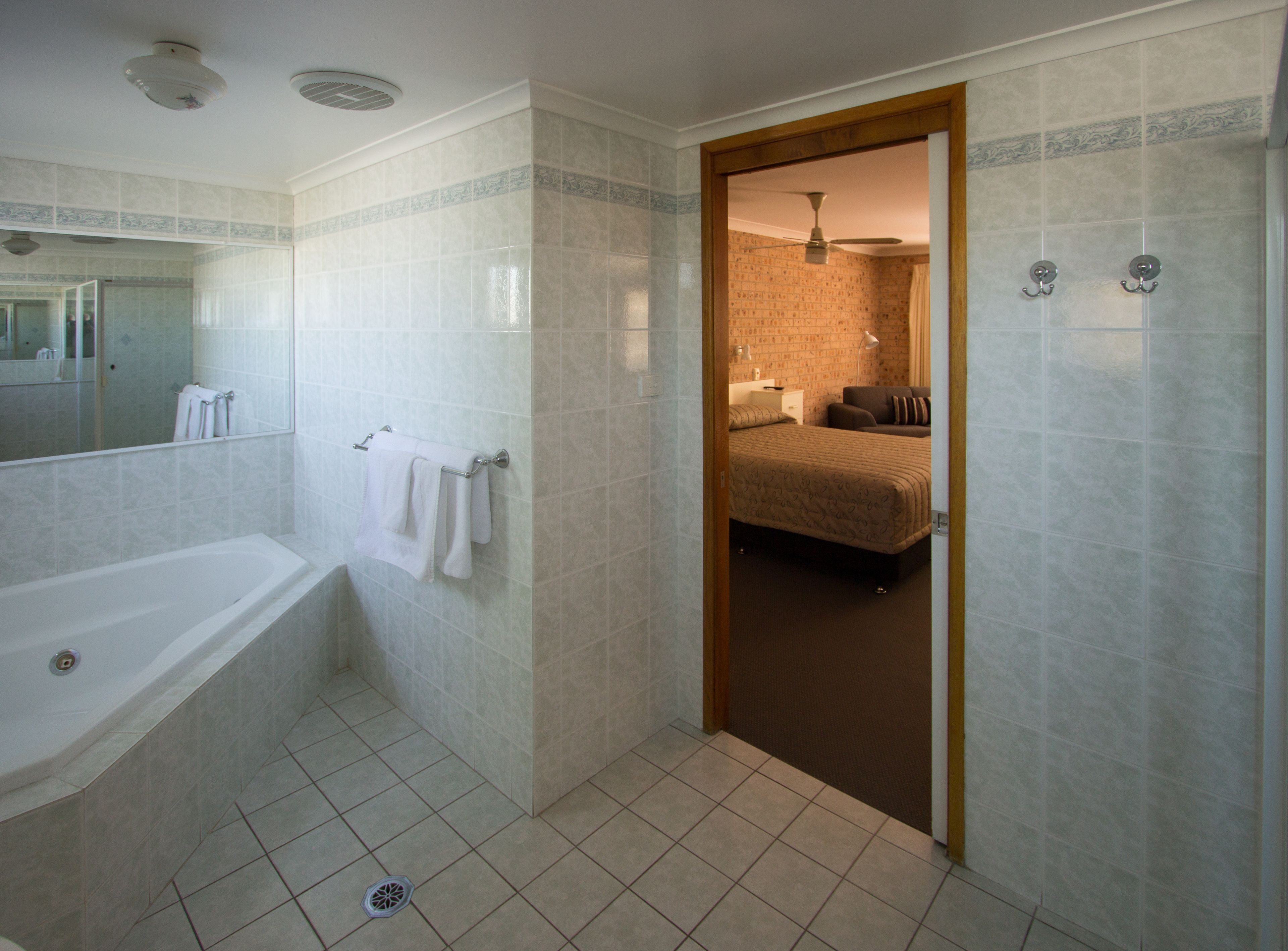 A bathroom with a bathtub, a shower, and a toilet.