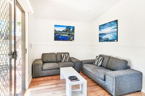 Deluxe Cabin, 2 Bedrooms | Living area | Flat-screen TV, table tennis - Anglesea Family Caravan Park (Anglesea)