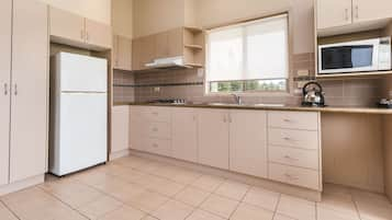 Deluxe Suite, 2 Bedrooms, Non Smoking, Kitchen (Deluxe Waterfront) | Private kitchen | Fridge, microwave, stovetop, coffee/tea maker