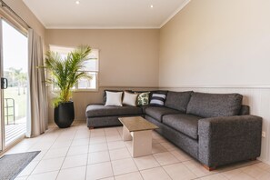 Deluxe Suite, 2 Bedrooms, Non Smoking, Kitchen (Deluxe Waterfront) | Living area - Clyde View Holiday Park (Batehaven)