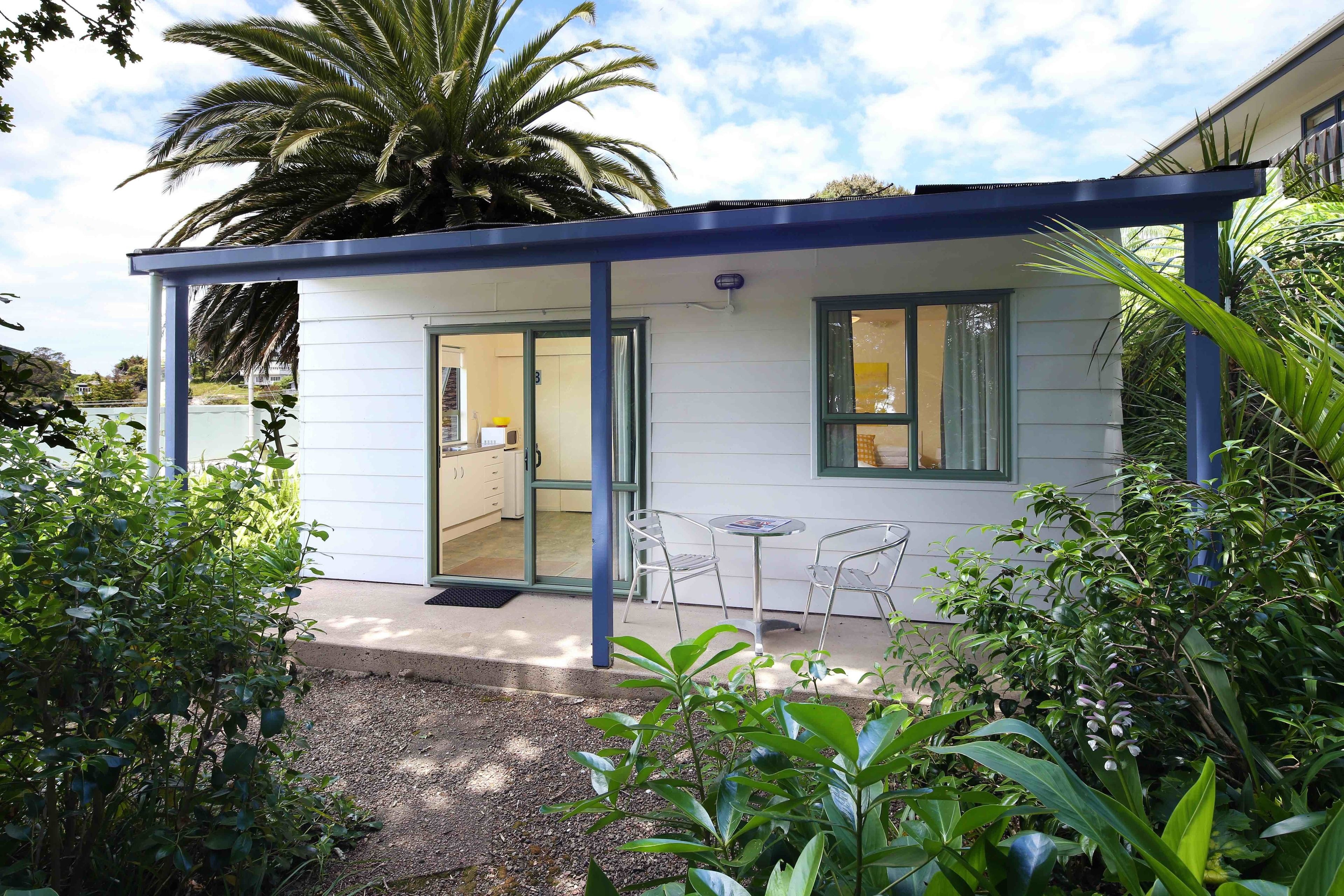 A small, single-story building with a covered patio area.