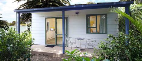 A small, single-story building with a covered patio area.