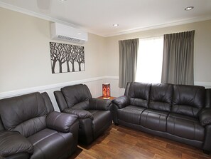 Eco Family Villa | Living area | TV - NRMA Atherton Tablelands Holiday Park (Atherton)