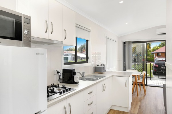 Deluxe Villa, 2 Bedrooms | Private kitchen | Coffee/tea maker, electric kettle, dining tables