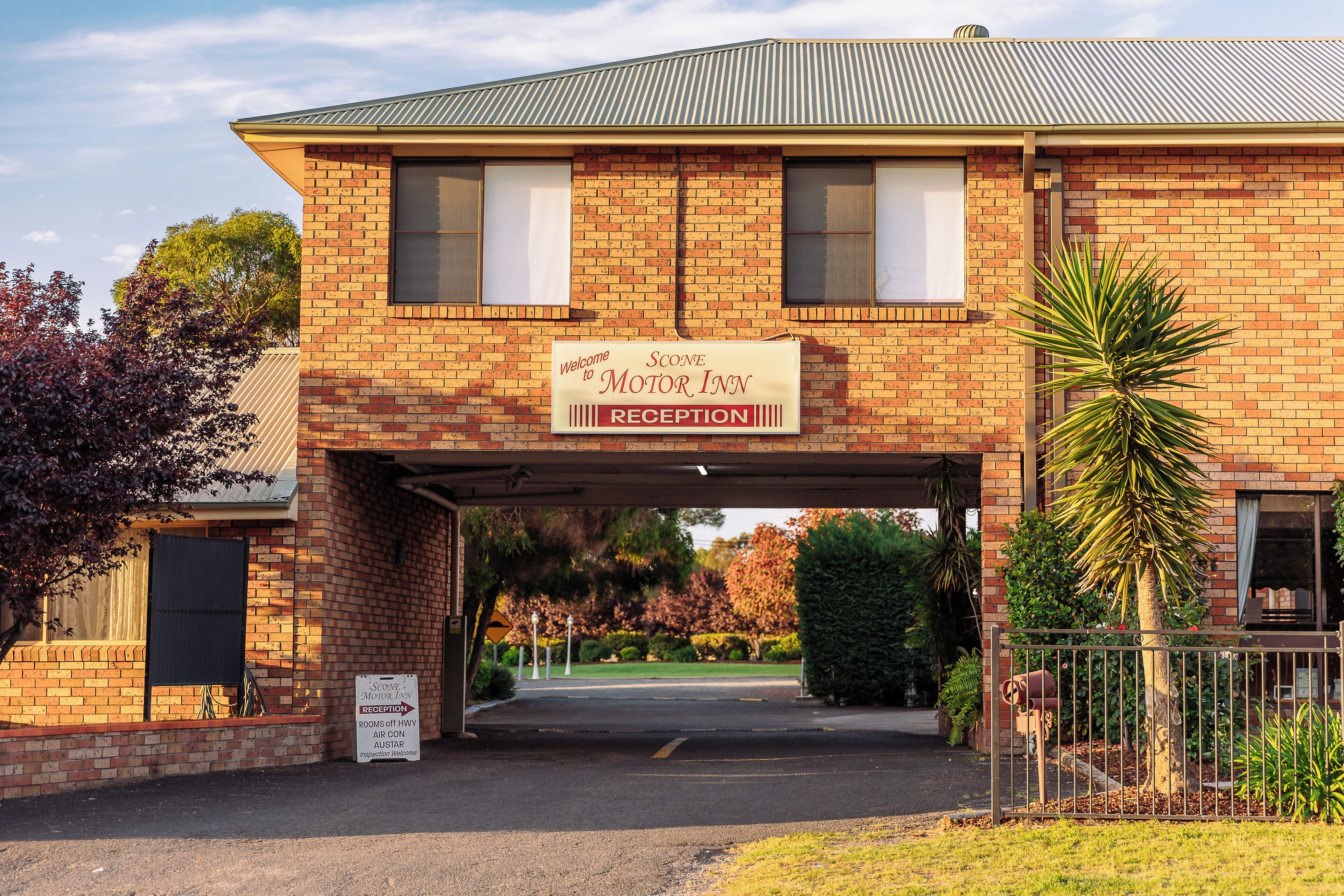 A brick building with a reception sign.