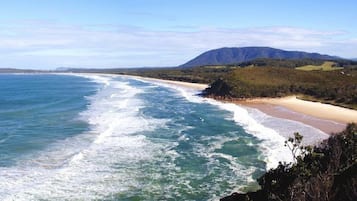 Beach nearby, white sand, beach towels