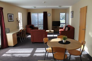 Executive Suite, 2 Bedrooms, Non Smoking, Kitchen (Executive apartment) | Living area | 42-inch flat-screen TV with satellite channels, TV