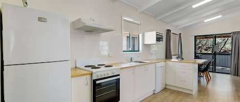 Spa Cottage Two Bedrooms (6 Berth) | Private kitchen | Full-sized fridge, microwave, stovetop, electric kettle