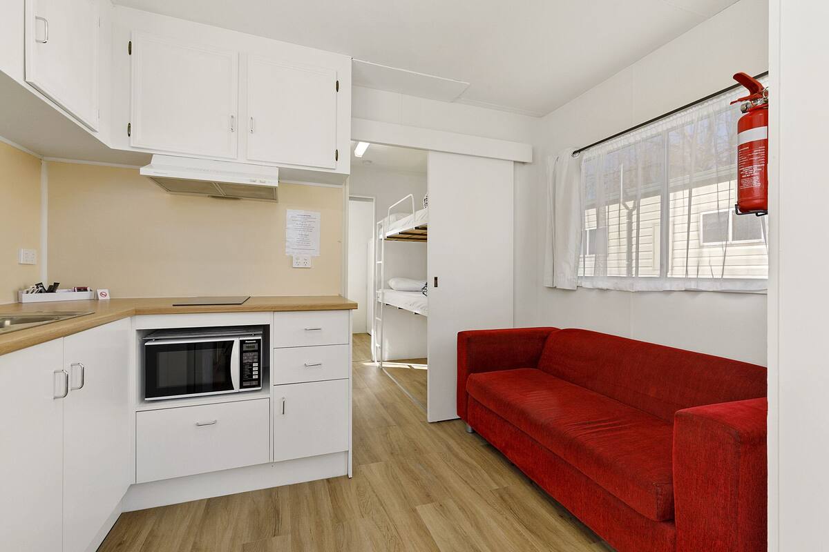 Budget Ensuite Cabin (4 Berth) | Living area | 40-inch Smart TV with digital channels
